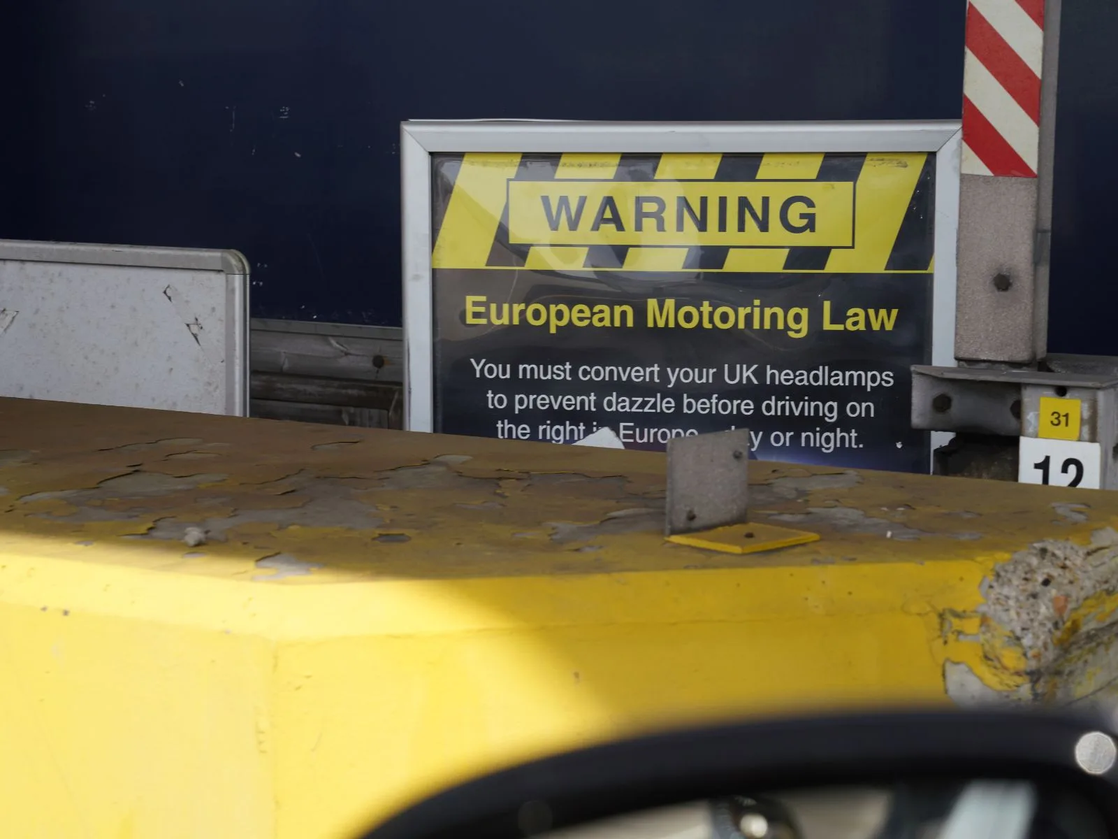 The sign at Dover: UK headlamps must be converted before driving on the right. See our driving in the Netherlands guide